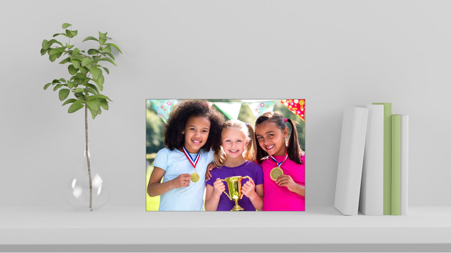 Custom ceramic tile with children photo on a living room bookshelf, front view, landscape