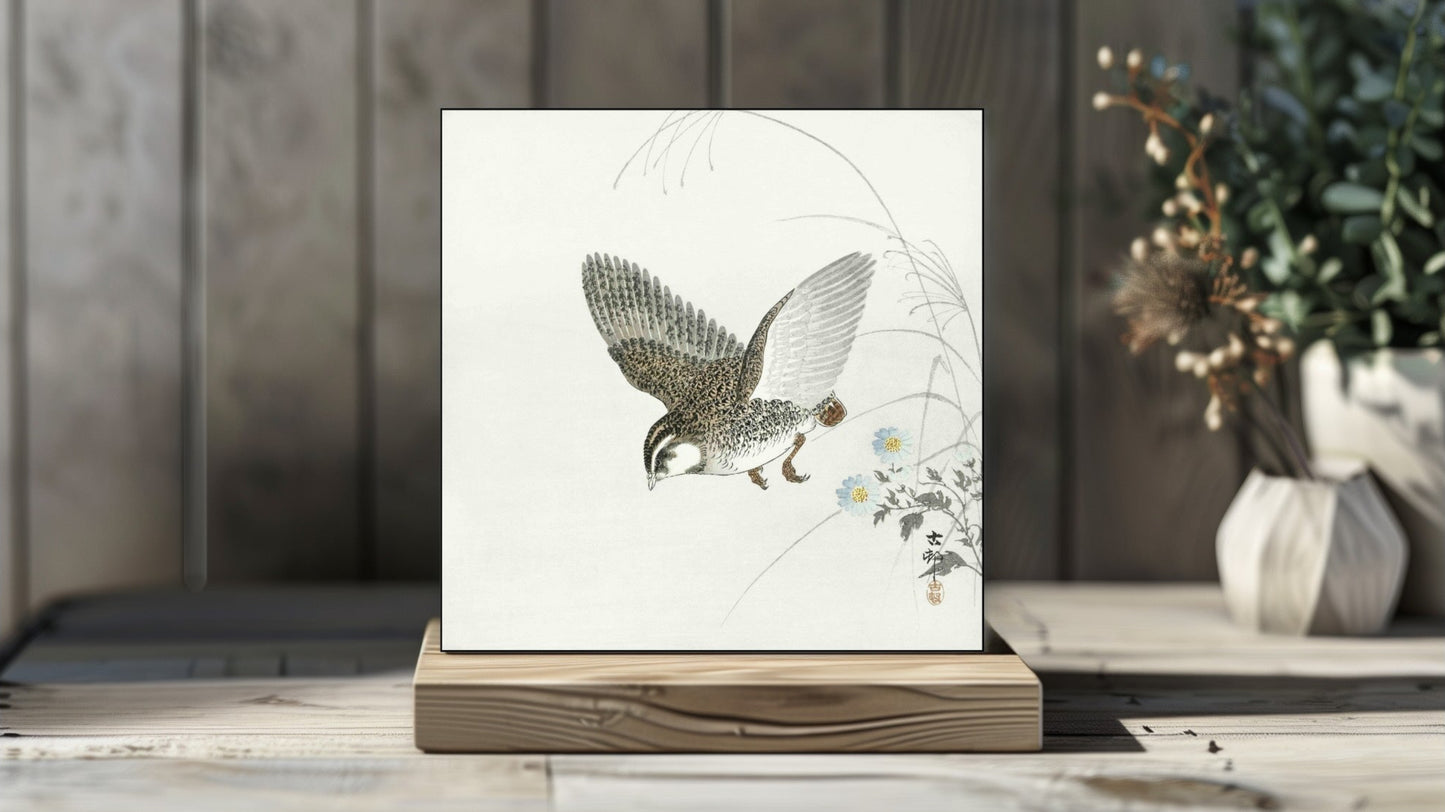 Ohara Koson's Ukiyo-e style 'Flying Quail' Japanese art on a decorative ceramic tile (digital representation).