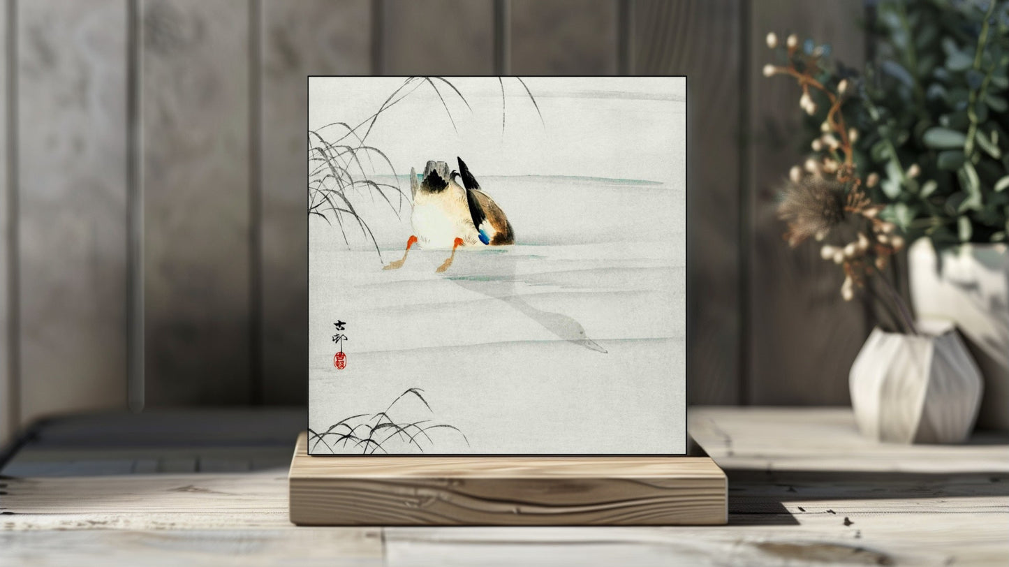 Ohara Koson's Ukiyo-e style 'Mallard, Head Under Water' Japanese art on a decorative ceramic tile (digital representation).