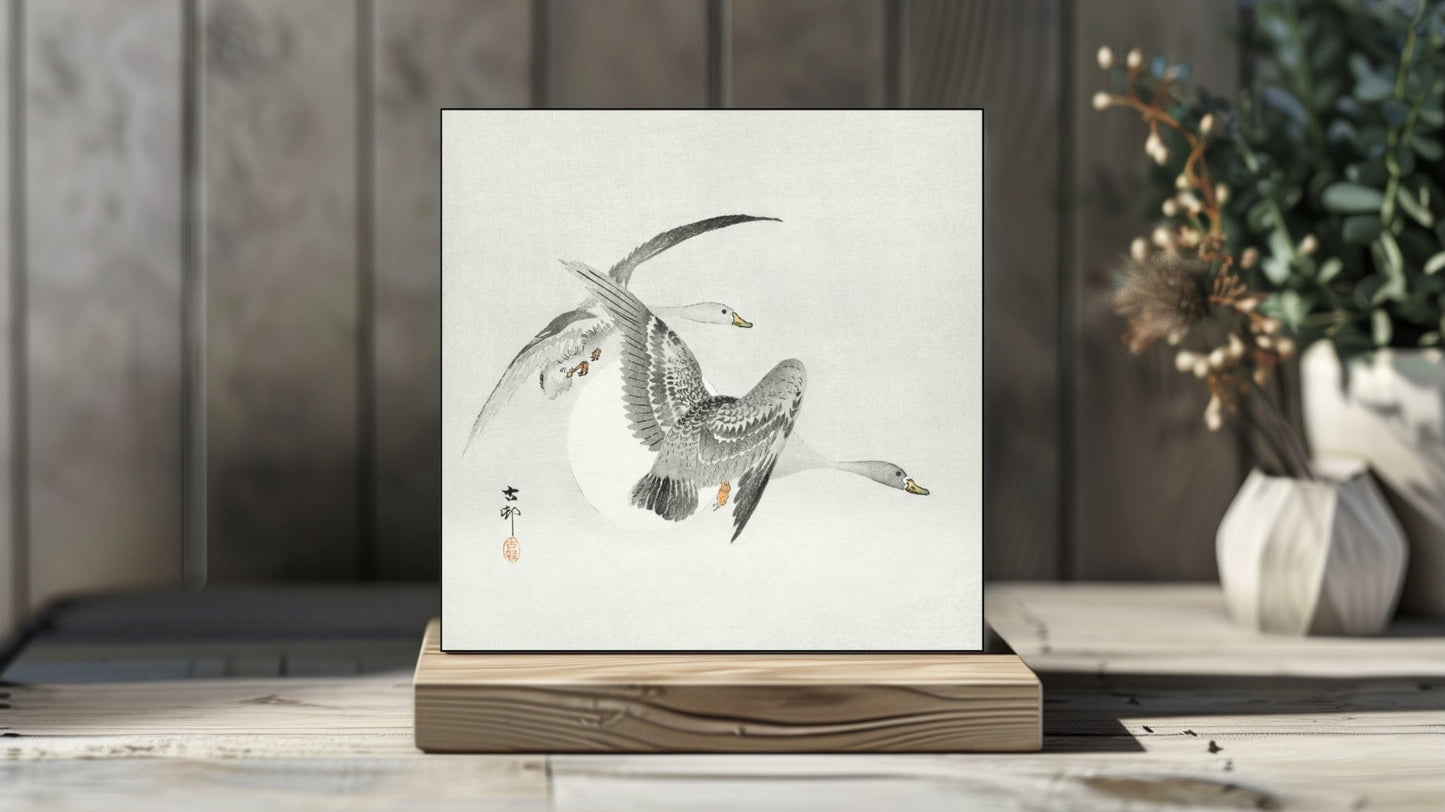 Ohara Koson's Ukiyo-e style 'Two Colt Geese in Flight' Japanese art on a decorative ceramic tile (digital representation).