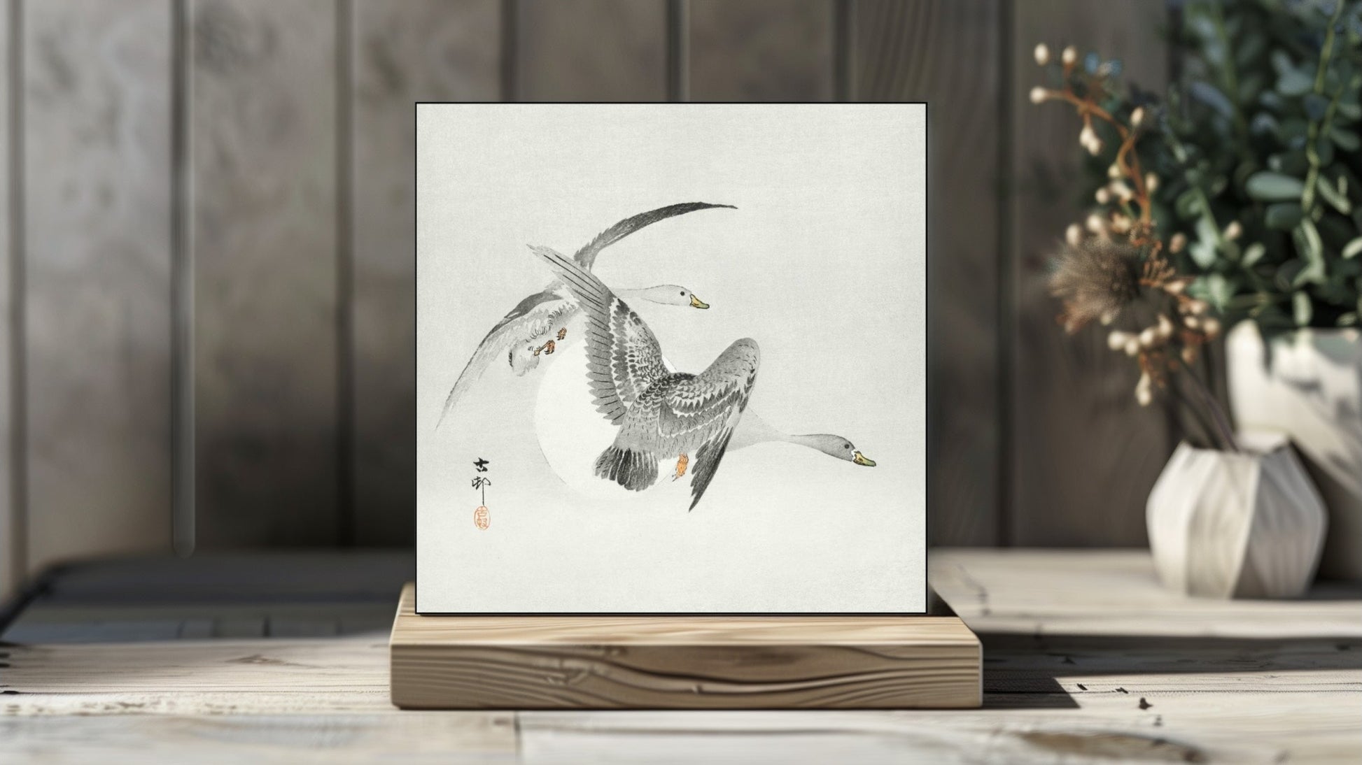 Ohara Koson's Ukiyo-e style 'Two Colt Geese in Flight' Japanese art on a decorative ceramic tile (digital representation).