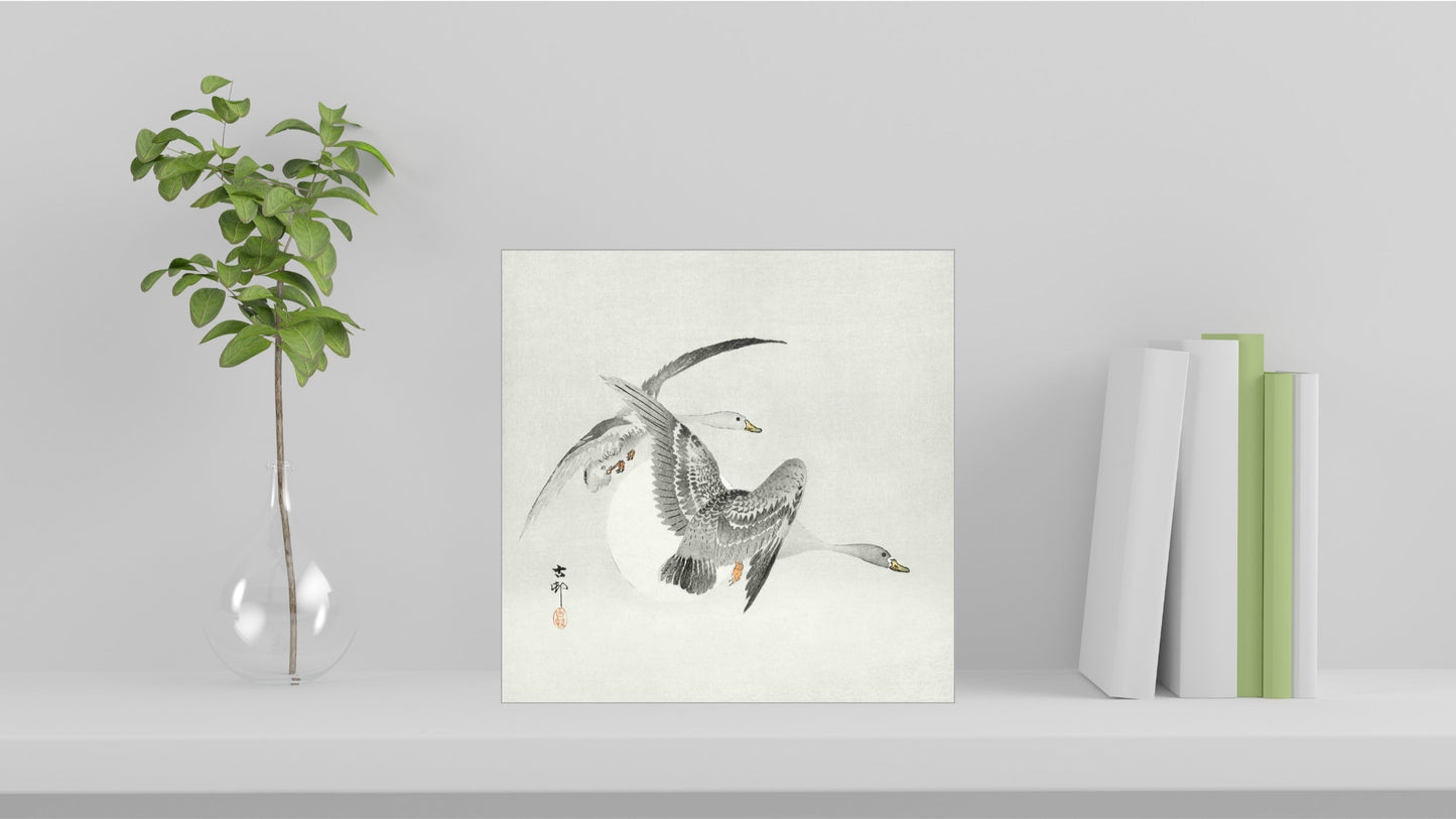 A visualisation of the Ohara Koson Japanese art tile, originally a woodblock print, featuring 'Two Colt Geese in Flight' used as home decor.